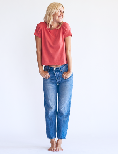 styled organic tee shirt in cozy radish red paired with jeans