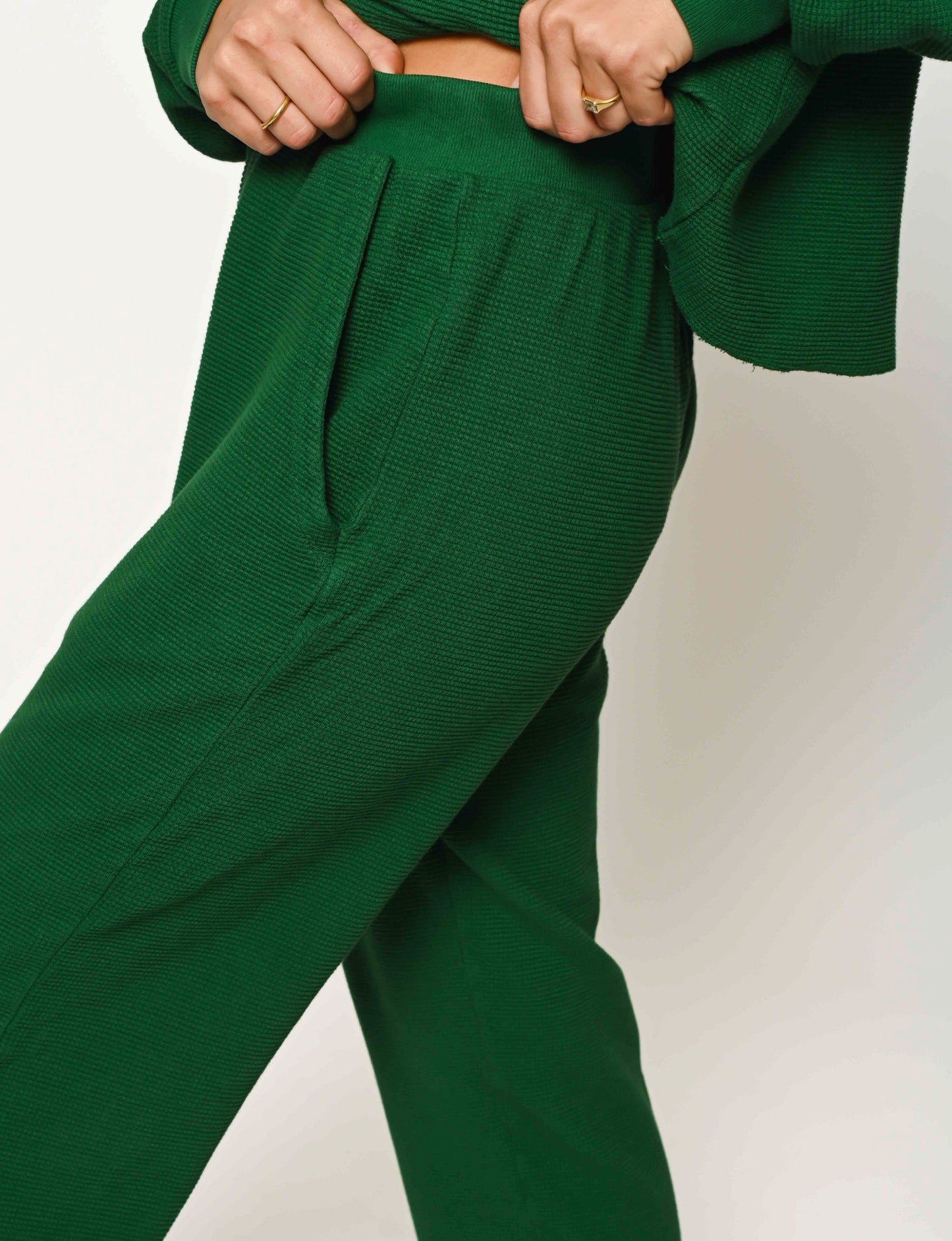 close up of textured organic thermal pant in forest green